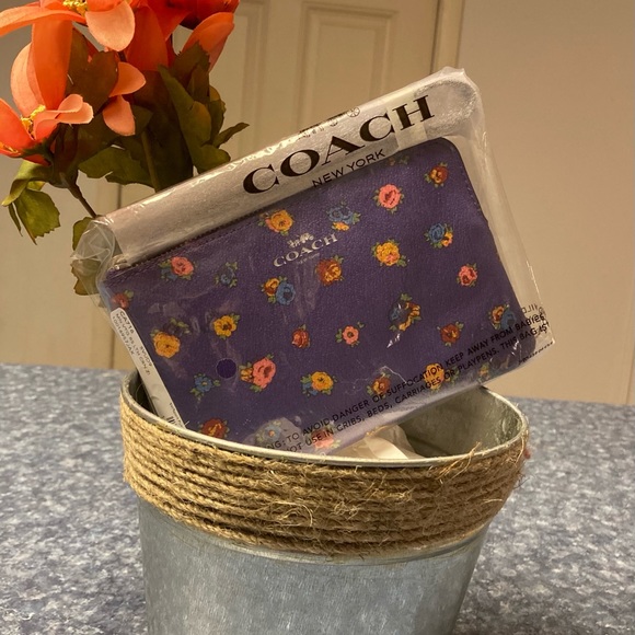 Coach Handbags - Coach Corner zip wristlet vintage rose print. Sv/sport purple multi.